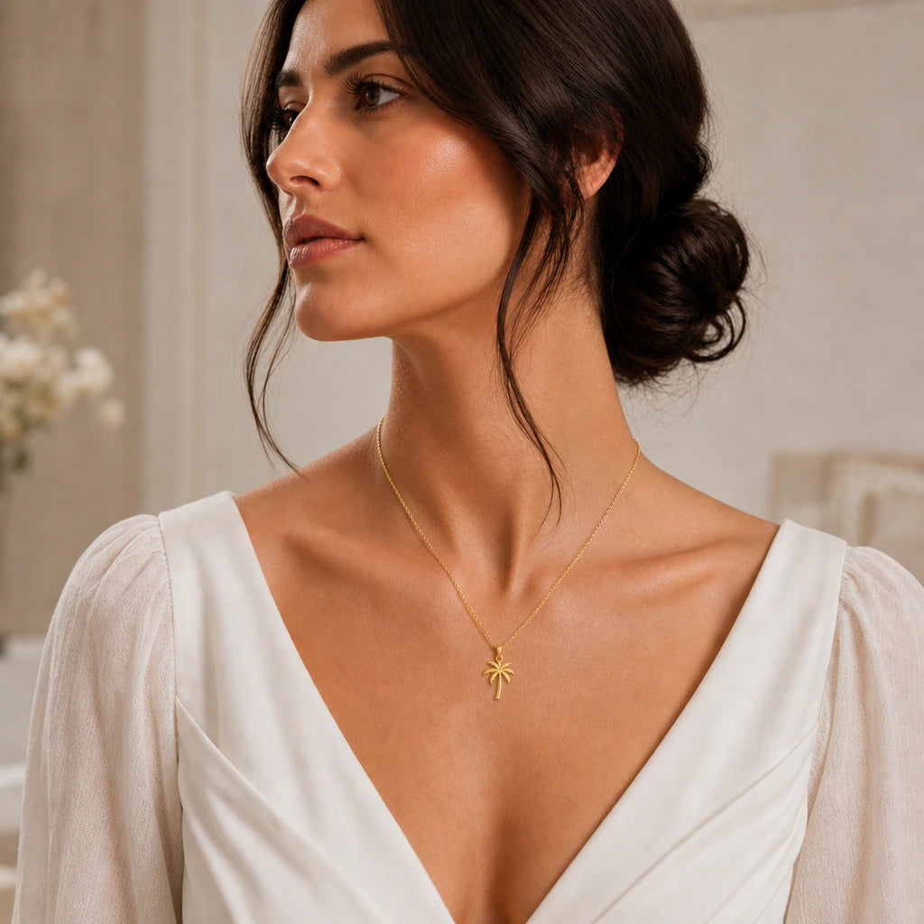 Palm tree pendant necklace worn by a model