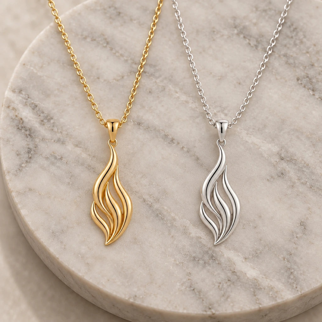 Aurora Flame pendant necklace in silver and gold finishes side by side