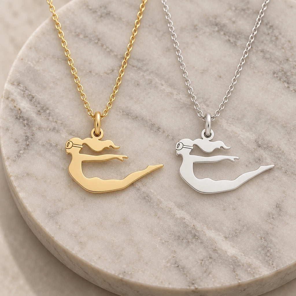 Diver Woman pendant necklace in silver and gold finishes side by side