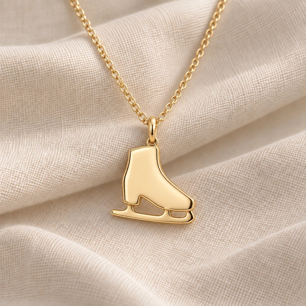 Ice Skate pendant necklace in an 18k gold plated finish