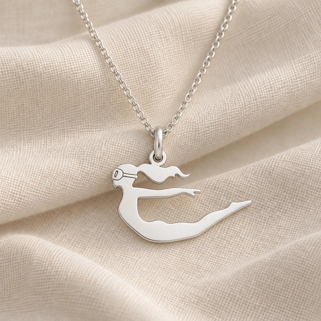 925 sterling silver diver woman pendant necklace on cream fabric
