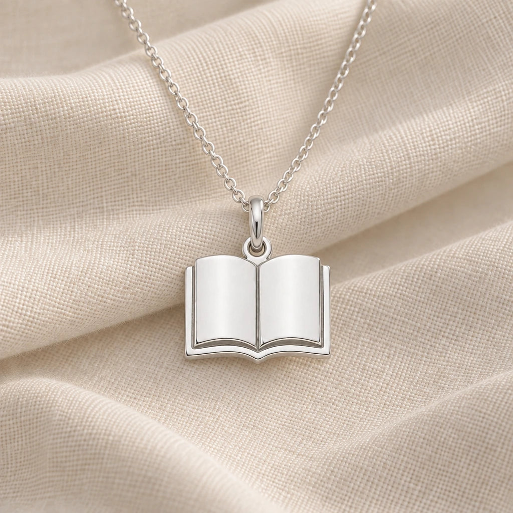 925 sterling silver open book solid pendant necklace on cream fabric