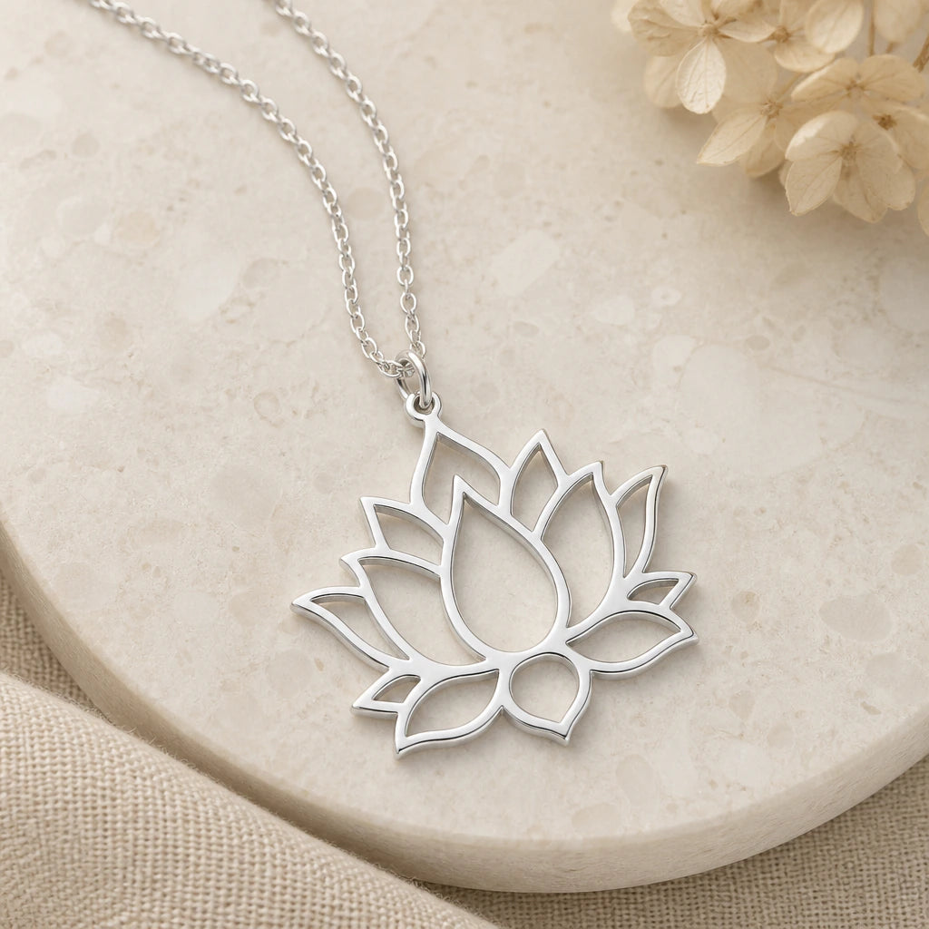 Close-up of silver lotus flower pendant showing the sculpted detail