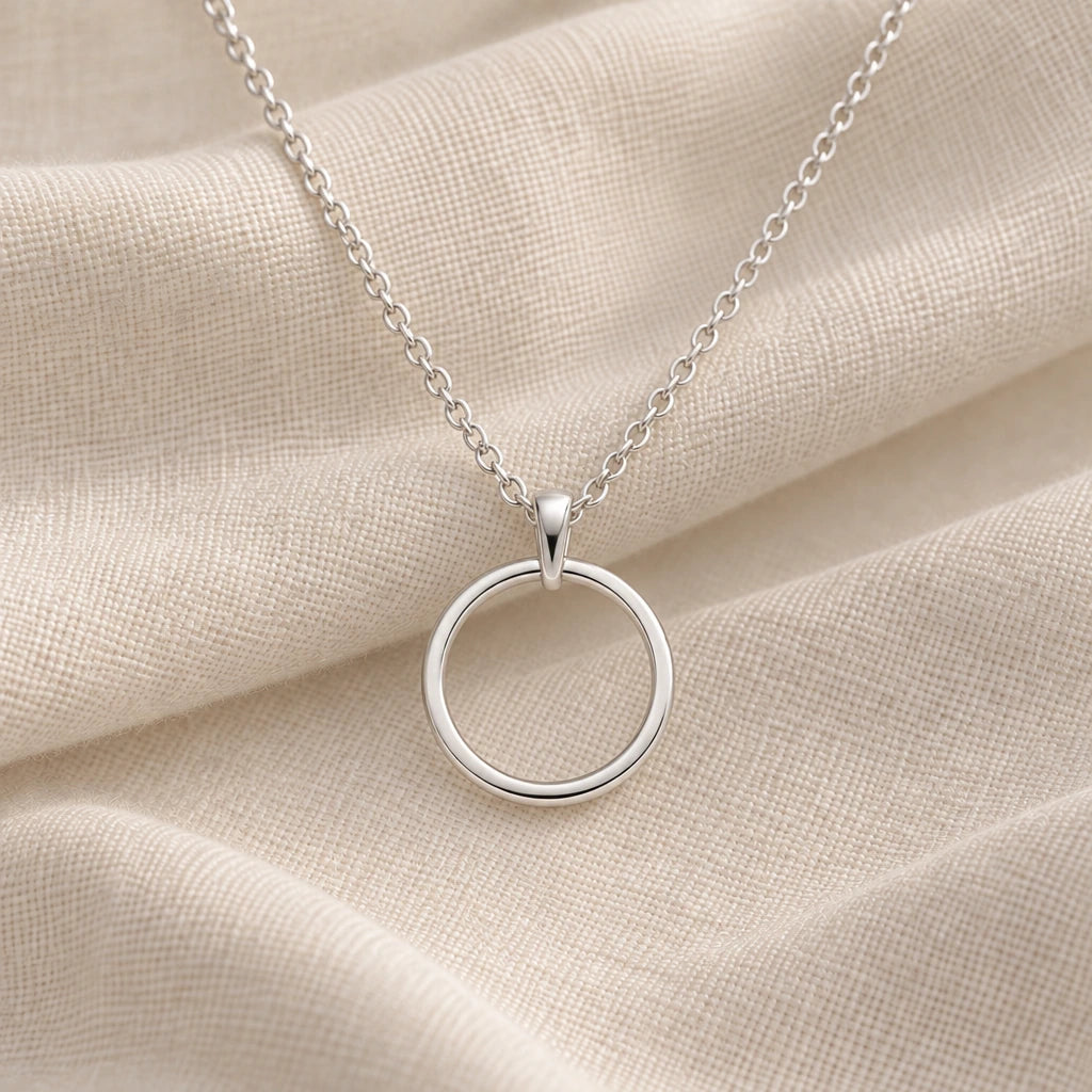 925 sterling silver open circle eternity pendant necklace on cream fabric