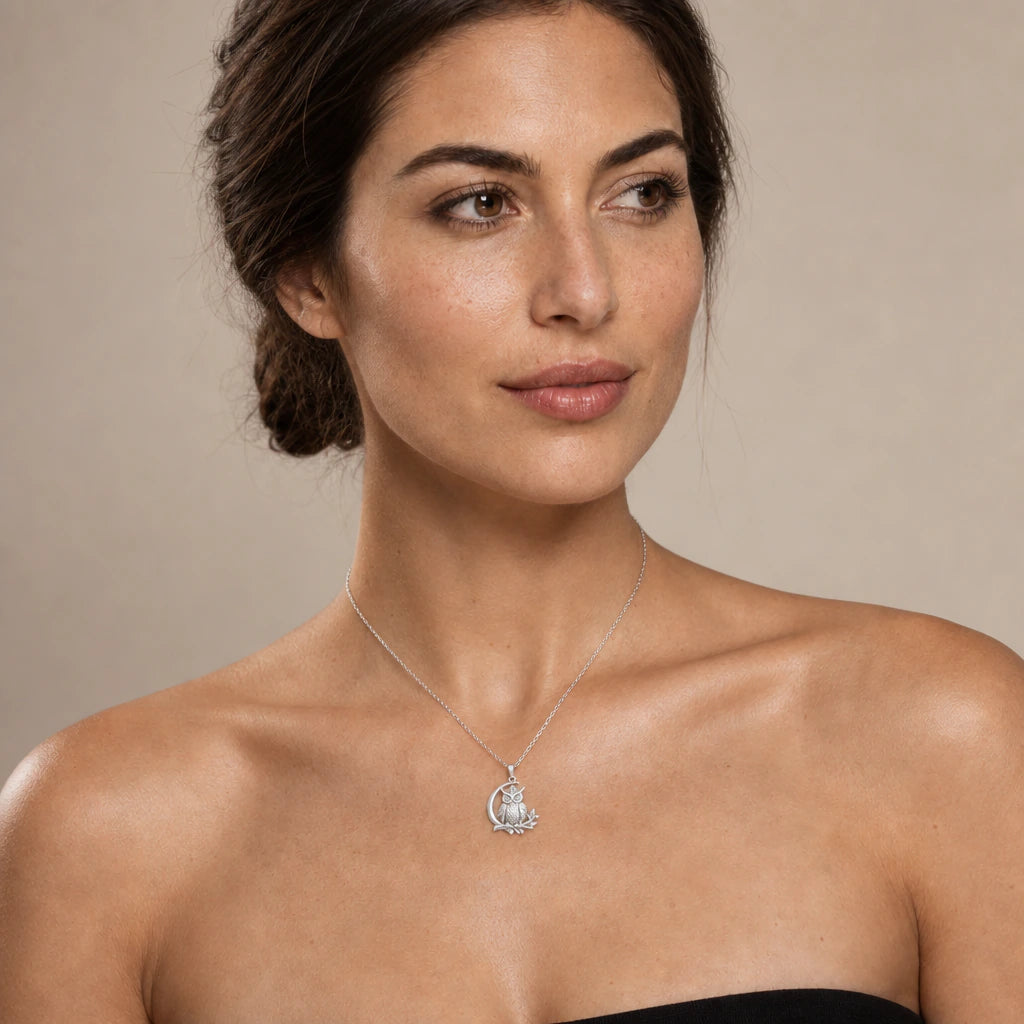 Moon Owl pendant necklace worn on a model, front close-up