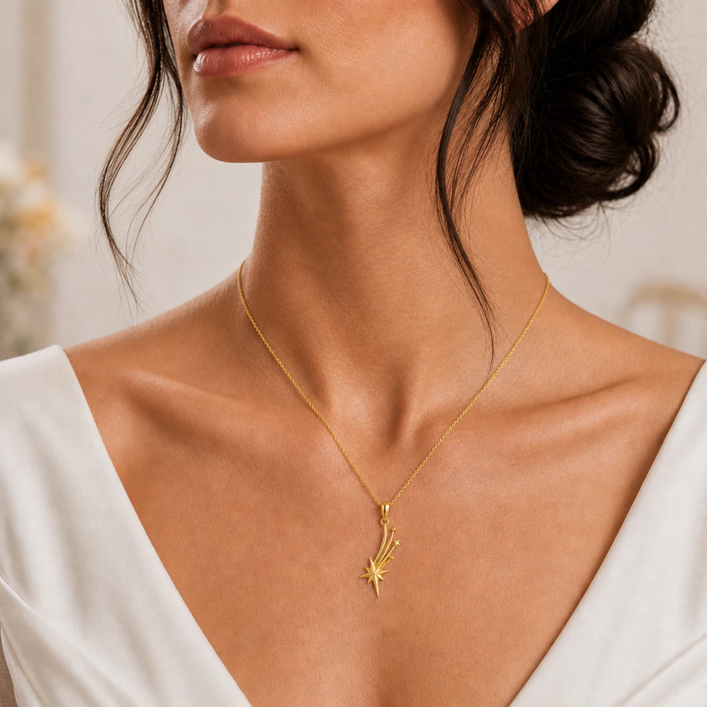 Shooting star pendant necklace worn, close-up
