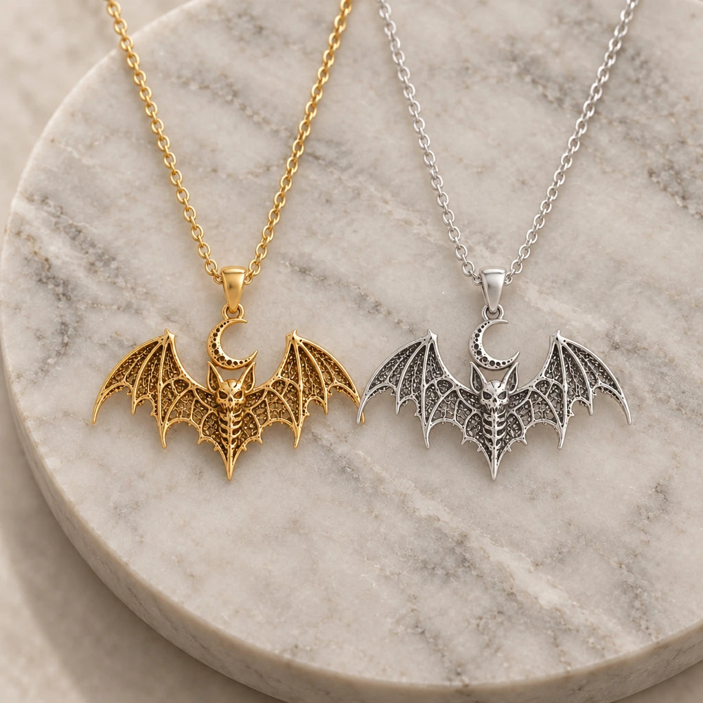 Lunar Bat Relic pendant necklace in silver and gold finishes side by side