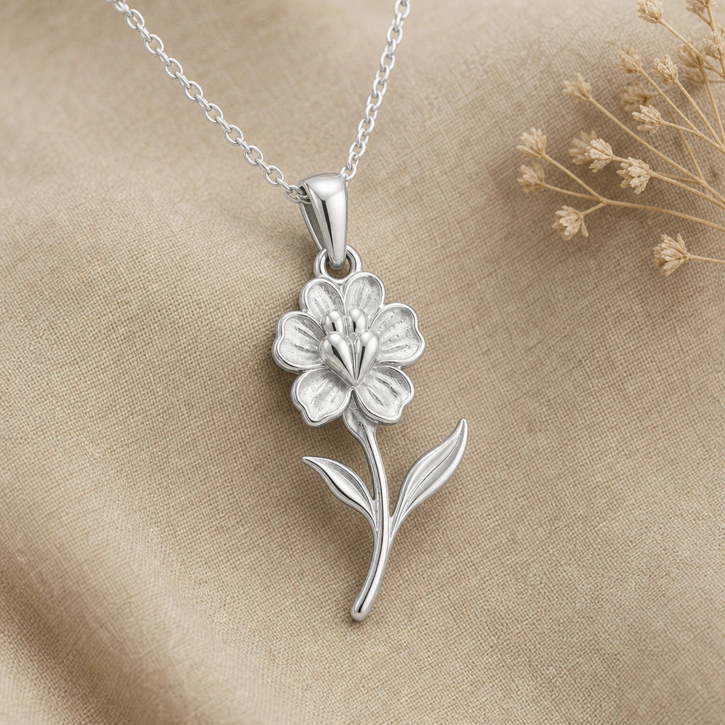 Close-up of silver snapdragon pendant with ruffled petals and leaves