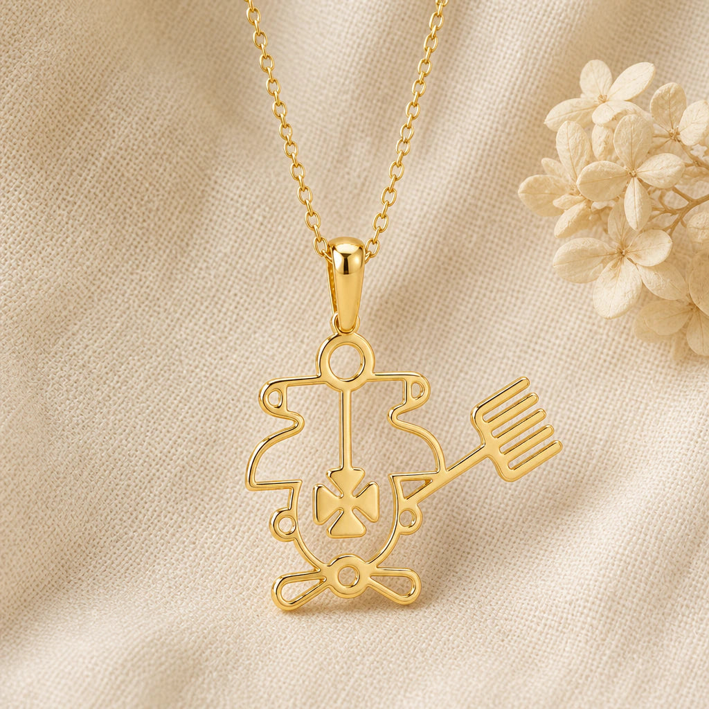 Purson Seal pendant necklace in a warm gold finish on cream fabric