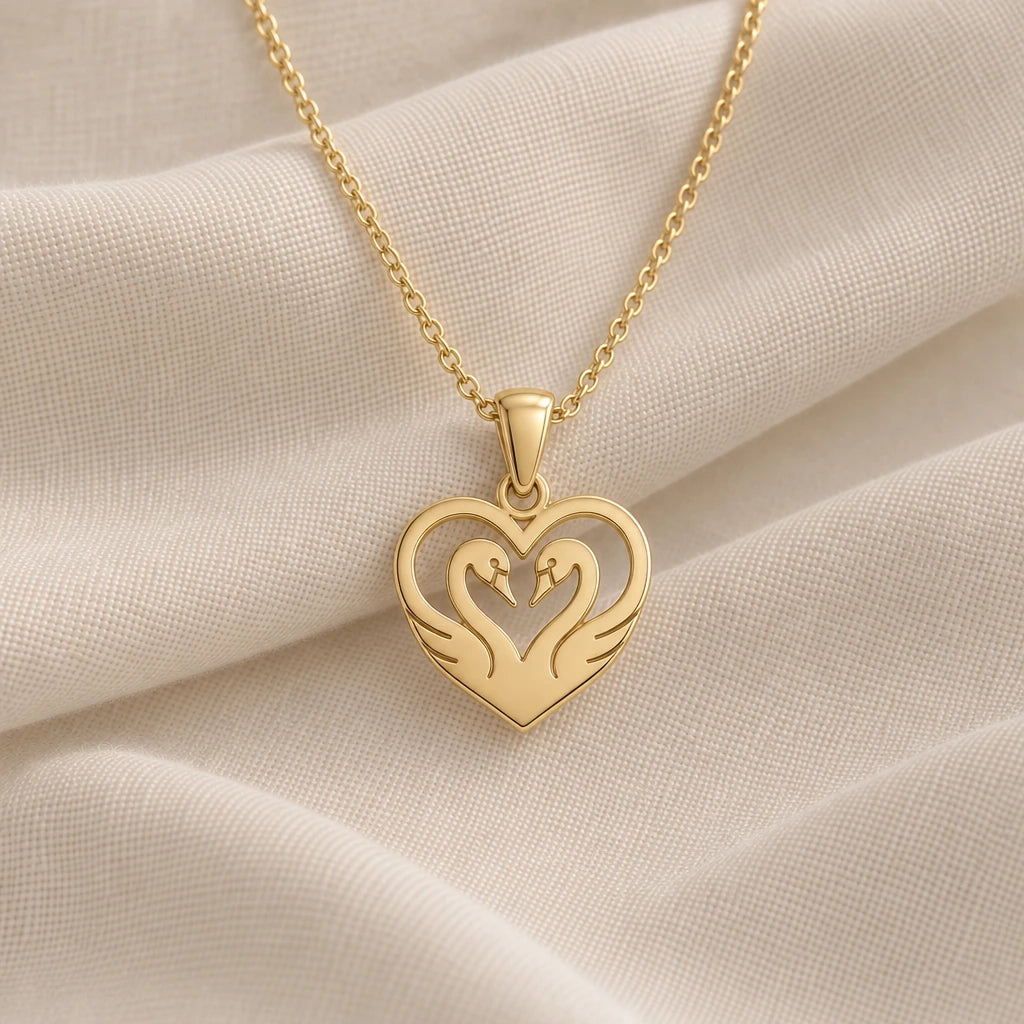 Heart Swan pendant necklace in an 18k gold plated finish