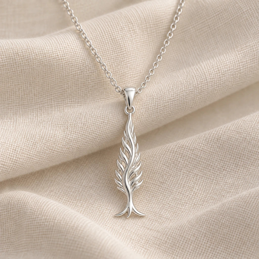 925 sterling silver cypress flame tree pendant necklace on cream fabric