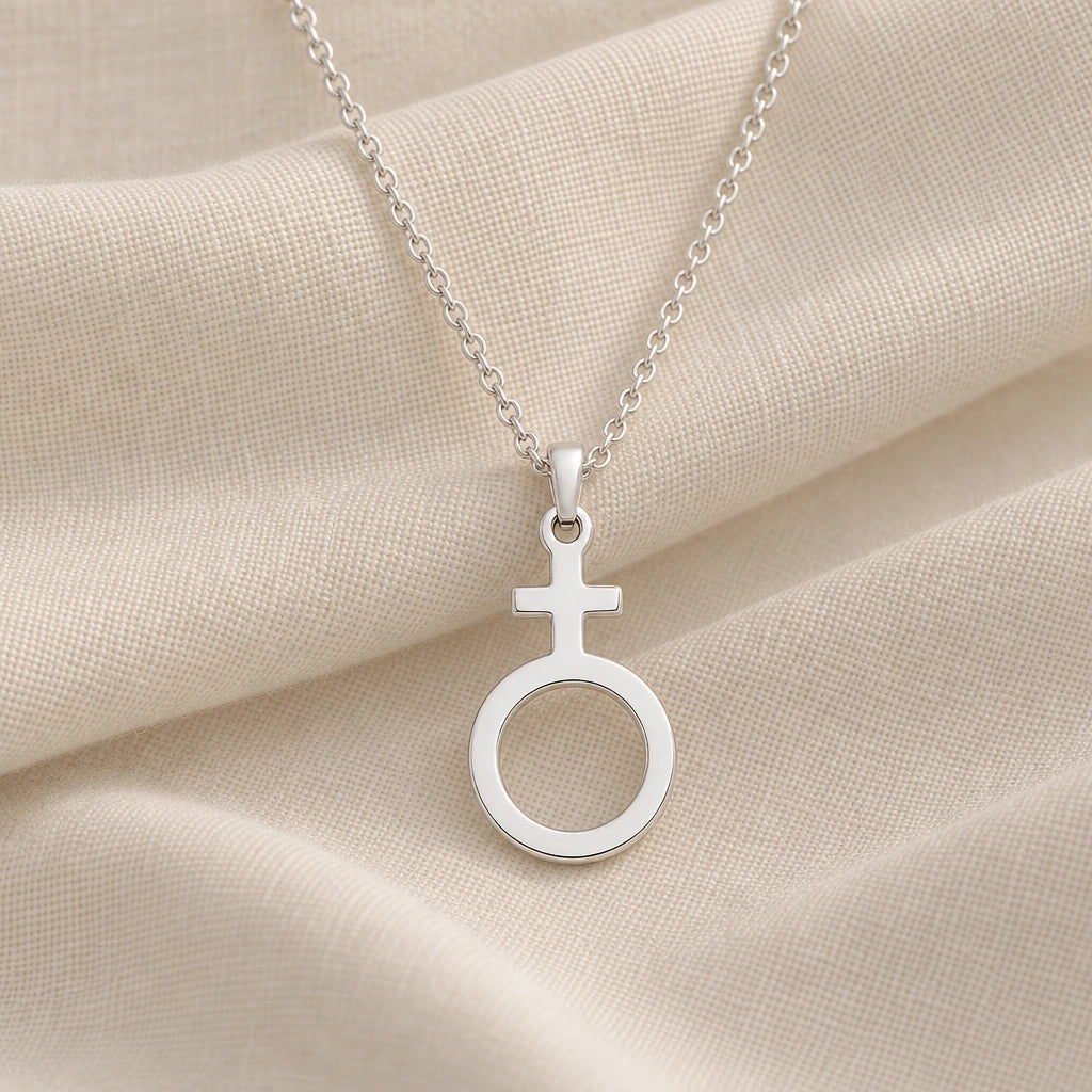 925 sterling silver antimony alchemy symbol pendant necklace on cream fabric