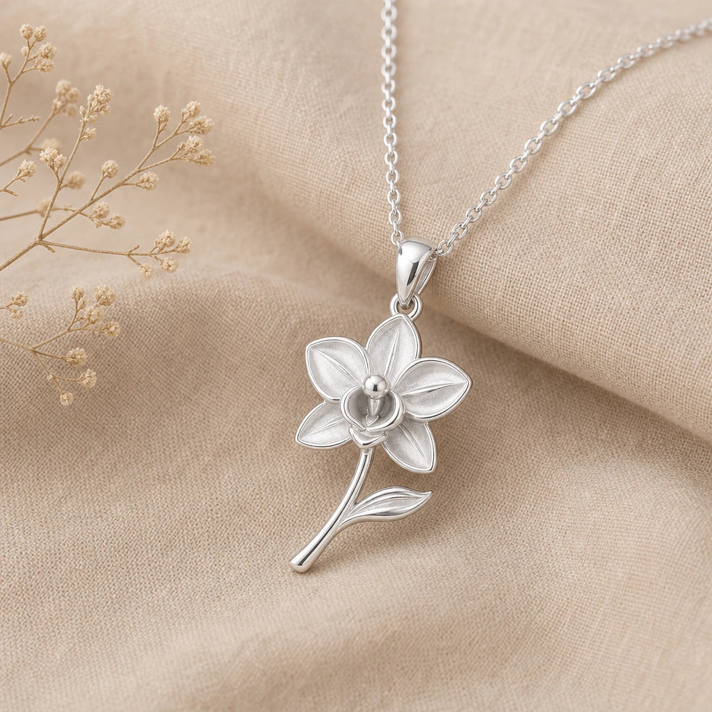 Close-up of silver orchid pendant with five petals and sculpted centre