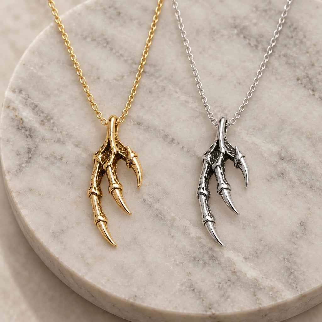 Dragon Claw pendant necklace in silver and gold finishes side by side