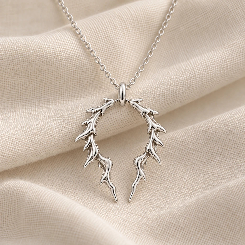 925 sterling silver broken halo thorn pendant necklace on cream fabric