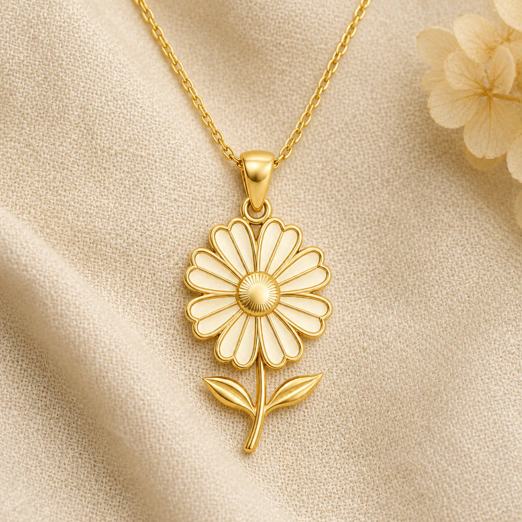 Cosmos Bloom Flower pendant necklace in a warm gold finish on cream fabric
