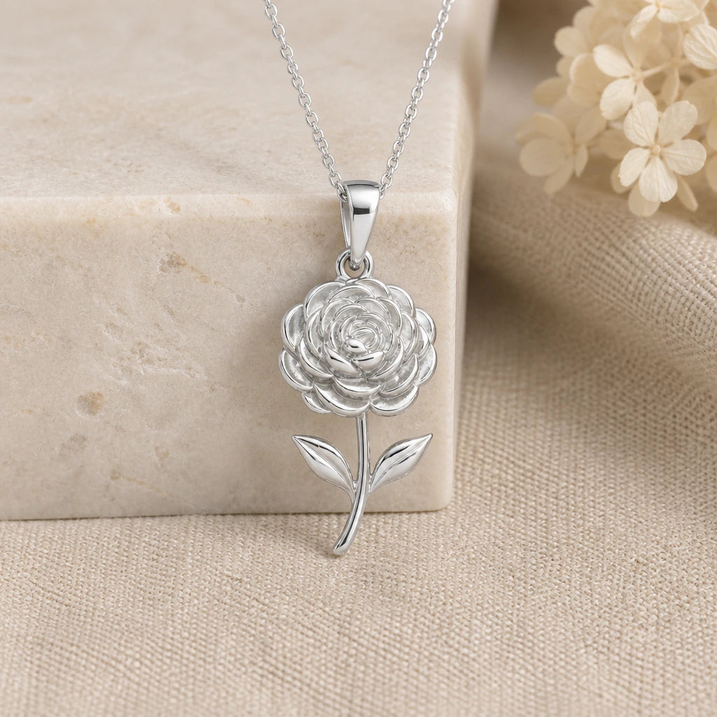 925 sterling silver ranunculus flower pendant necklace on softly folded cream linen
