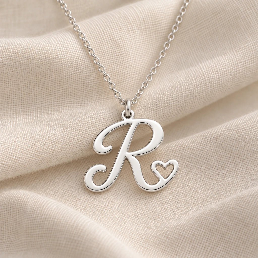 925 sterling silver r initial heart pendant necklace on softly folded cream linen