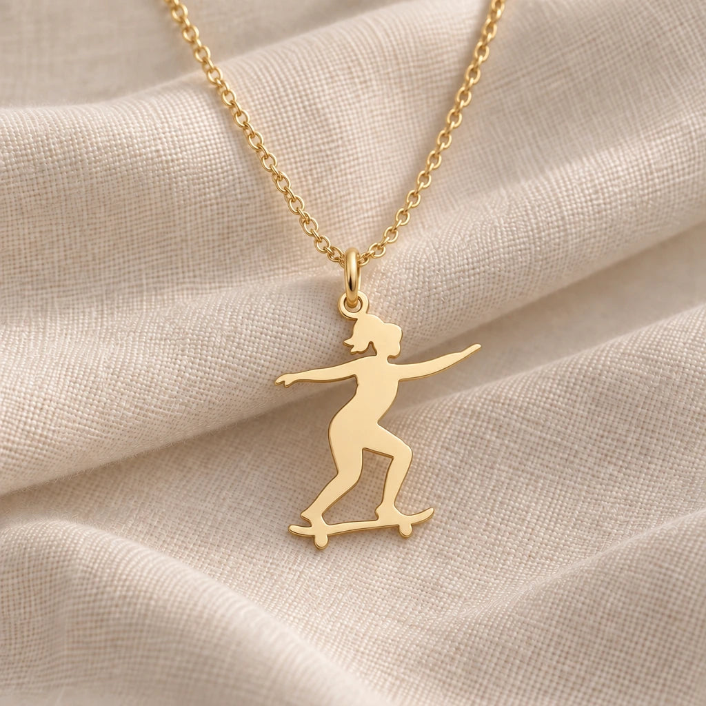 Skateboard Girl pendant necklace in an 18k gold plated finish
