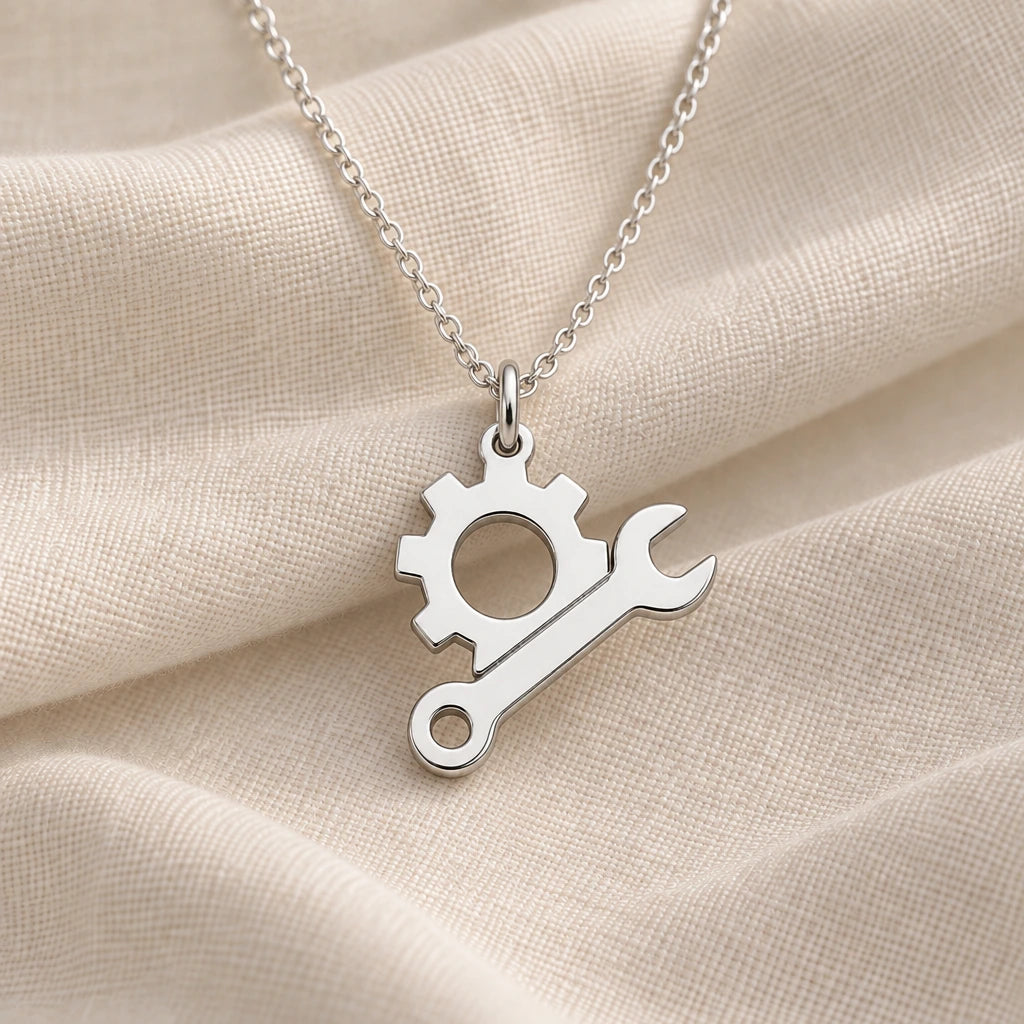 925 sterling silver engineer gear and spanner pendant necklace on cream fabric