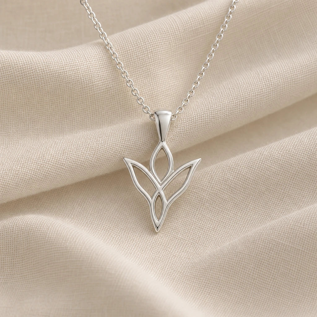 925 sterling silver elven knot leaf pendant necklace on cream fabric