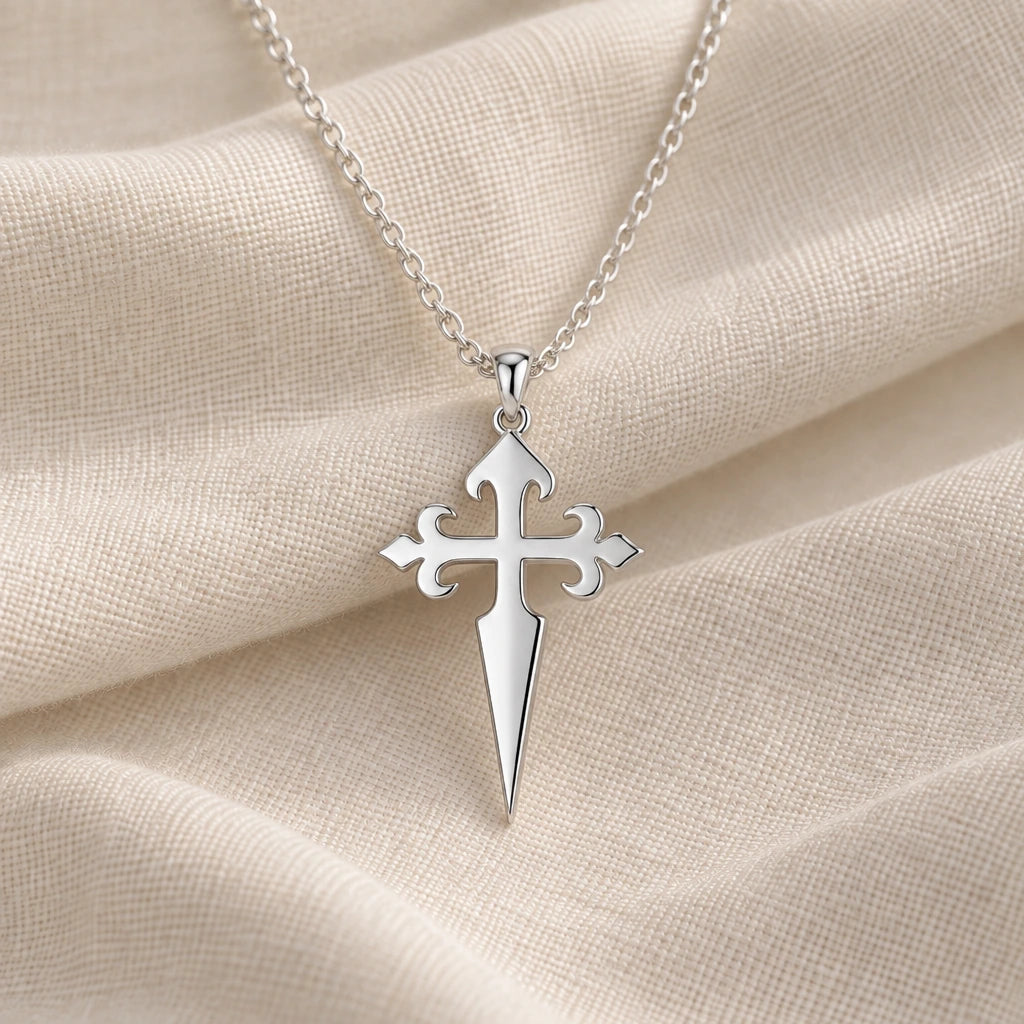 925 sterling silver gothic cross dagger pendant necklace on cream fabric
