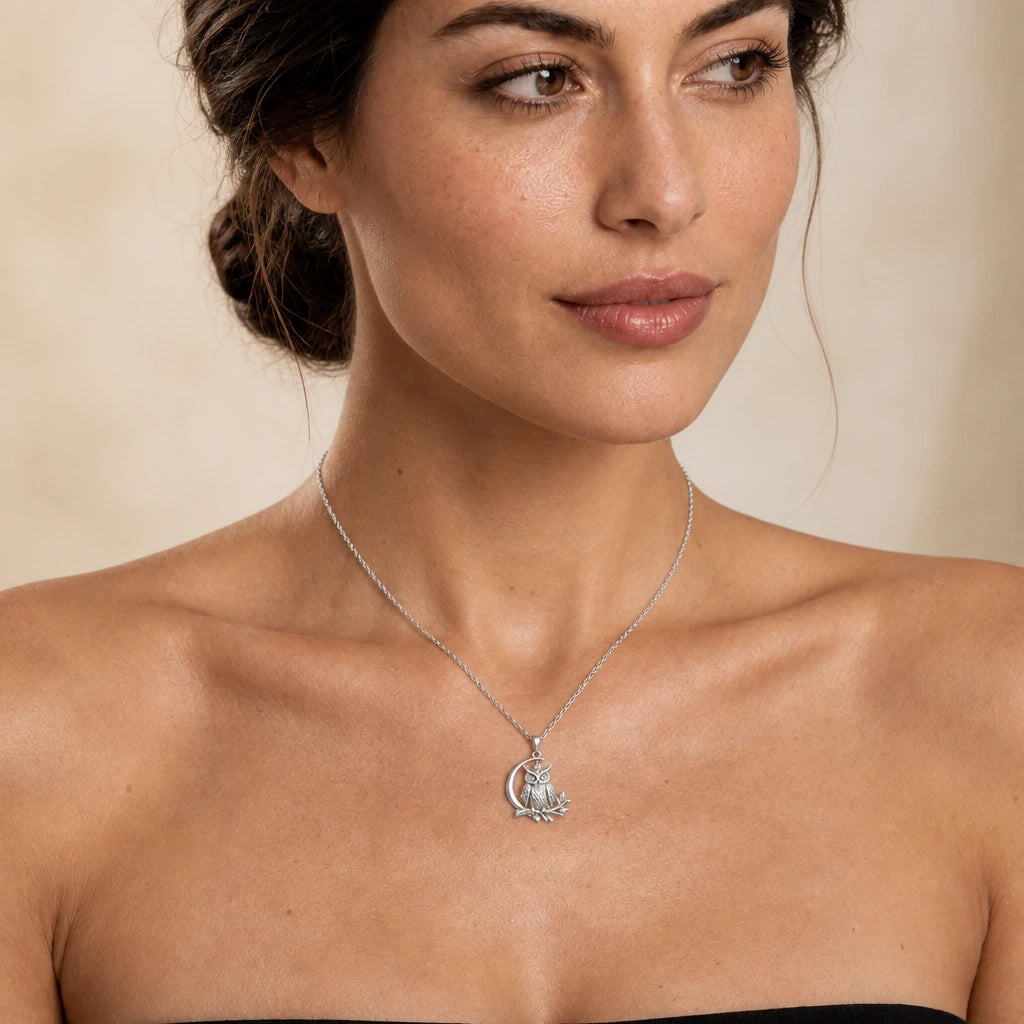 Moon Owl pendant necklace worn by a model, natural lifestyle photograph