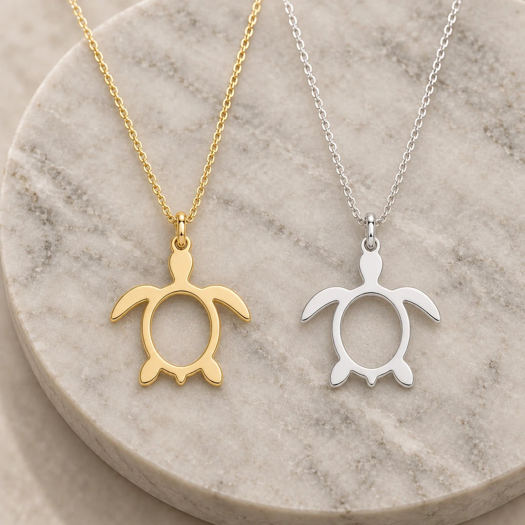 Sea Turtle Outline pendant necklace in silver and gold finishes side by side