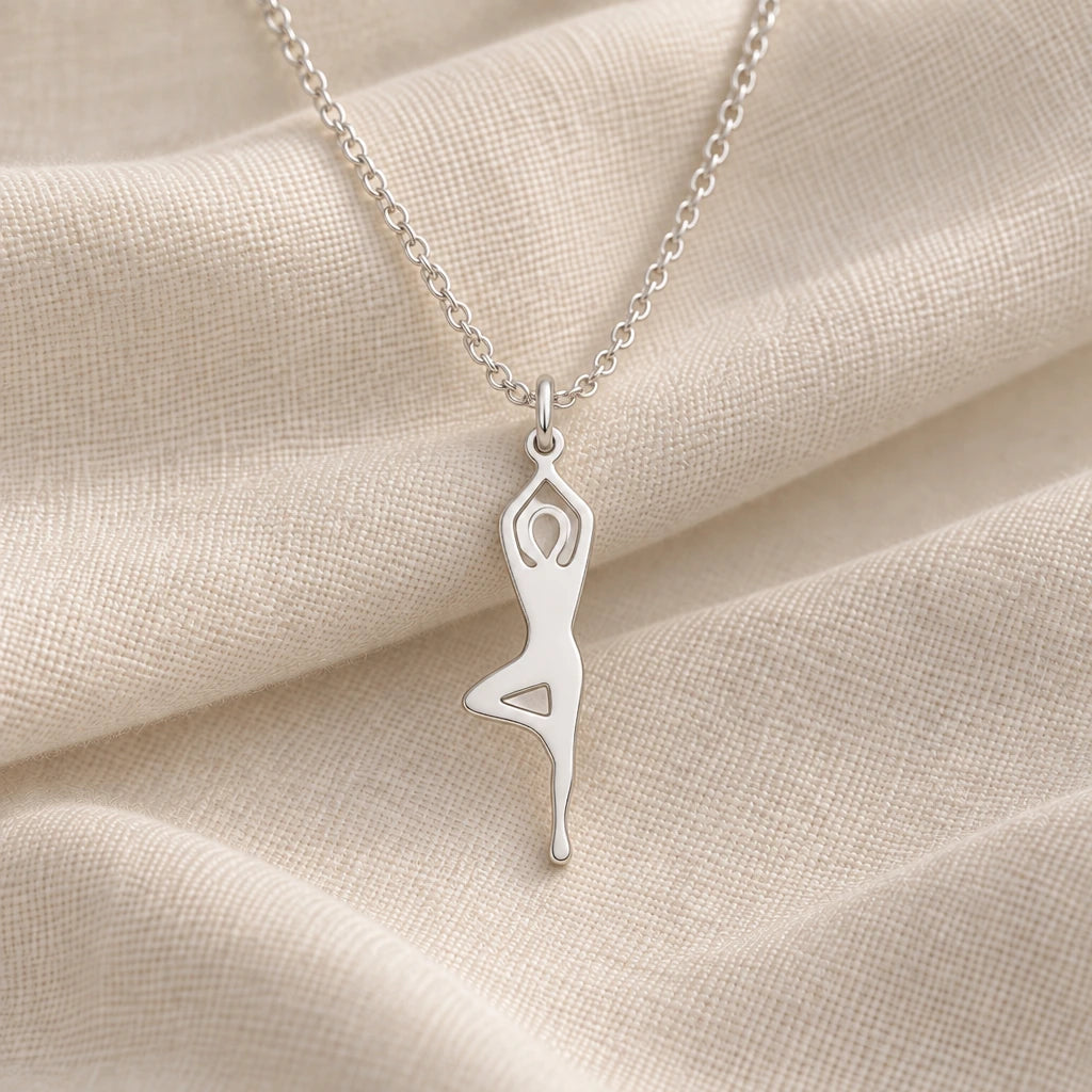 925 sterling silver yoga tree pose outline pendant necklace on cream fabric