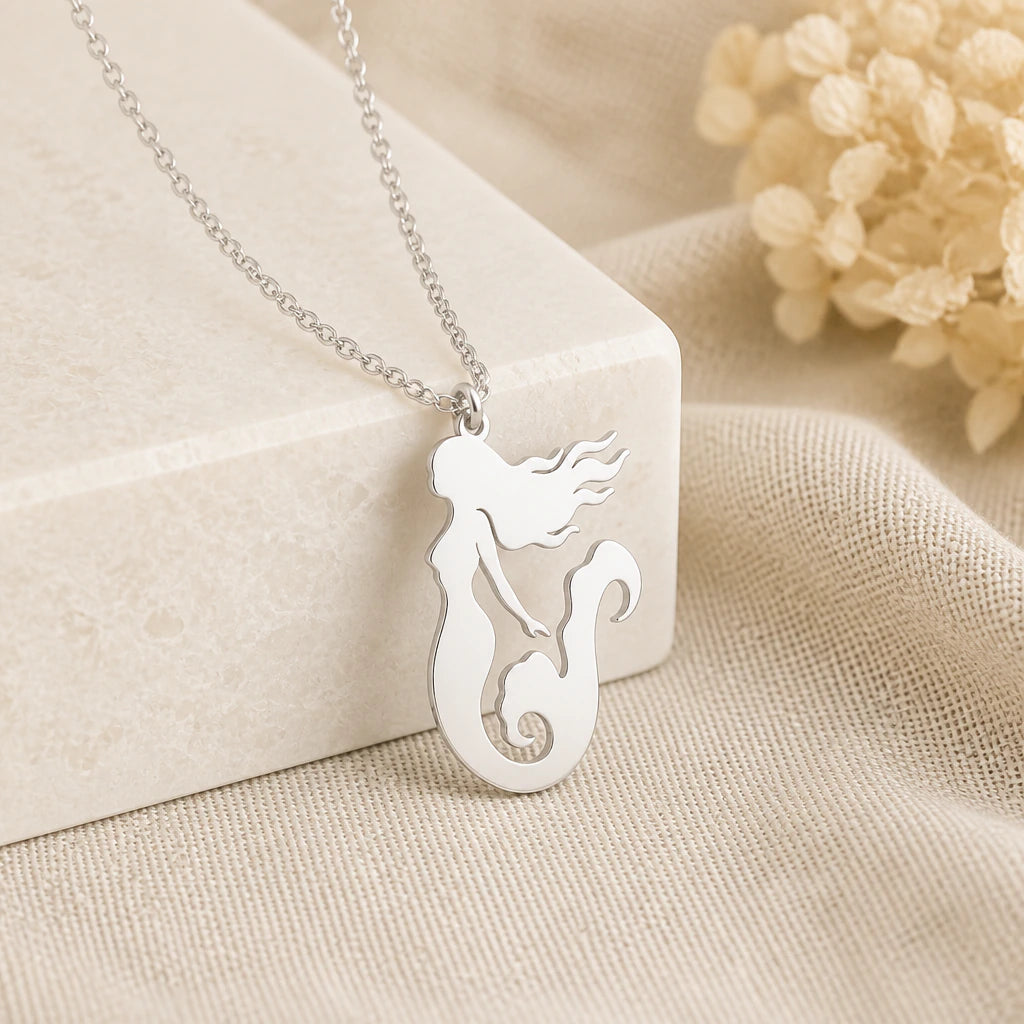 925 sterling silver mermaid pendant necklace on softly folded cream linen