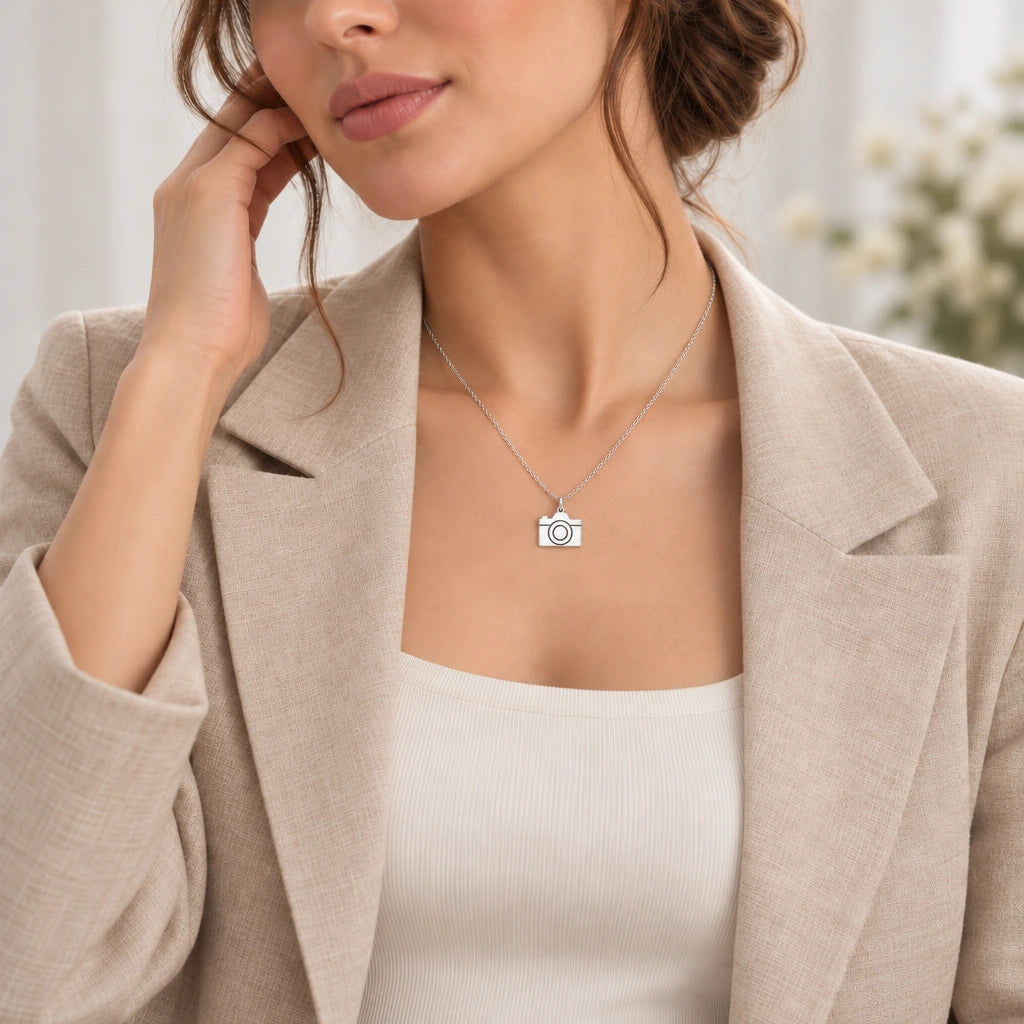 Camera pendant necklace worn by a model, lifestyle photograph