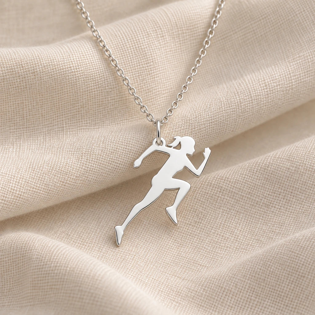 925 sterling silver running woman pendant necklace on cream fabric