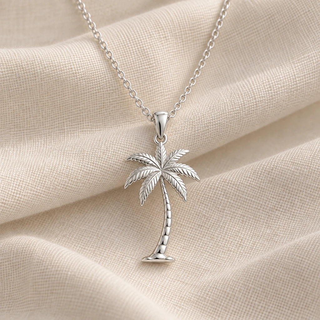 925 sterling silver palm breeze leaning tree pendant necklace on cream fabric
