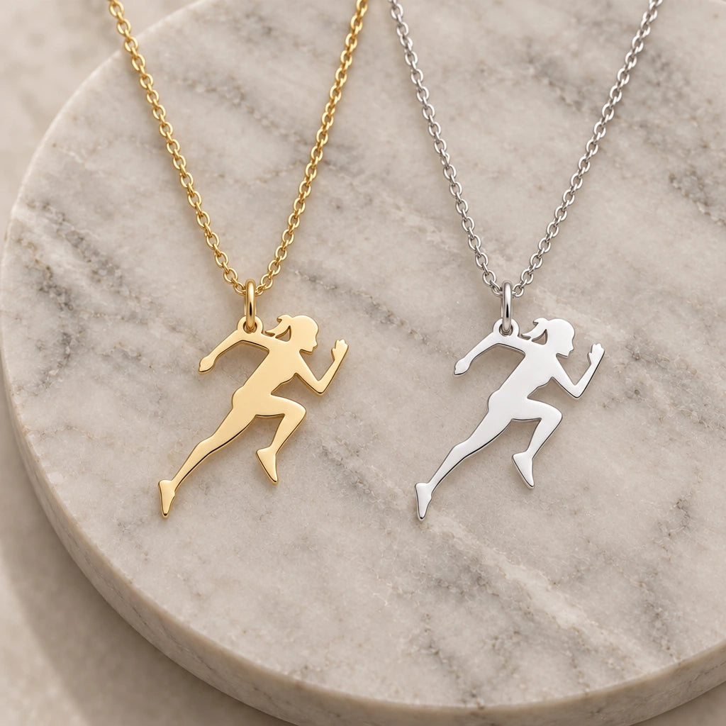 Running Woman pendant necklace in silver and gold finishes side by side