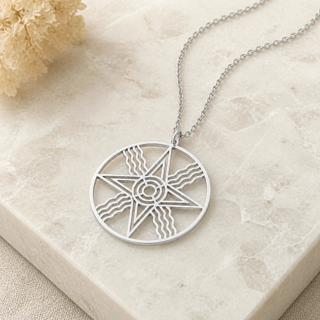 Close-up of silver sumerian sun star symbol pendant showing the sculpted detail