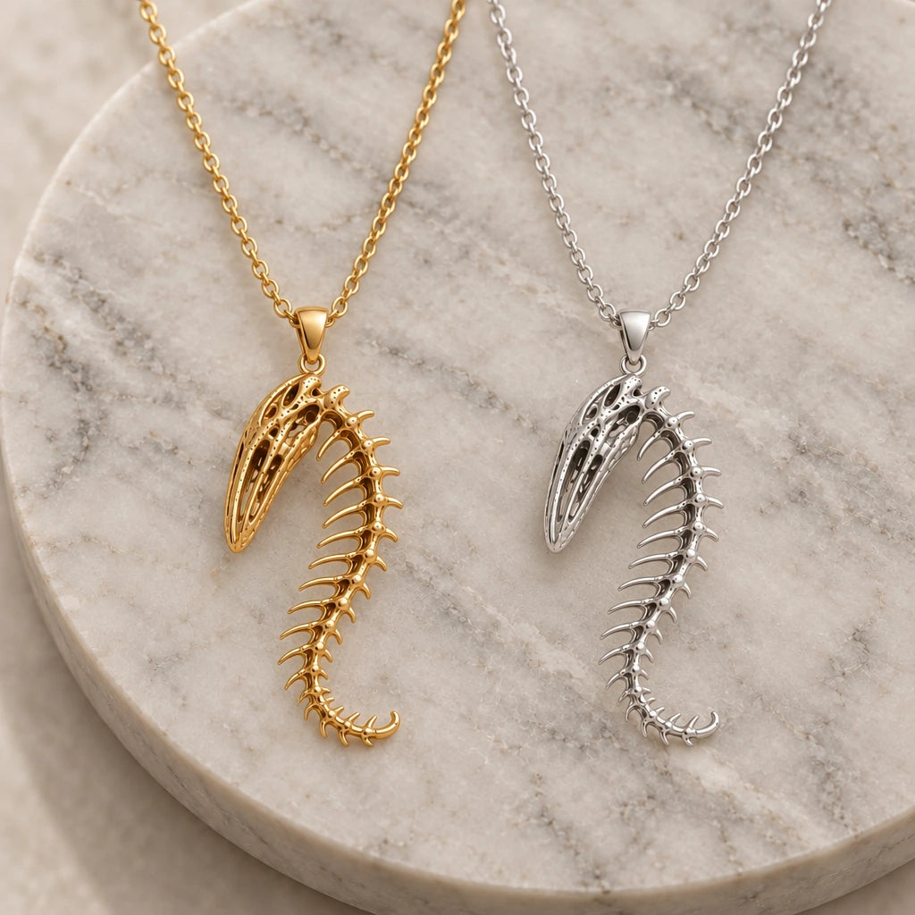 Whale Spine Relic pendant necklace in silver and gold finishes side by side