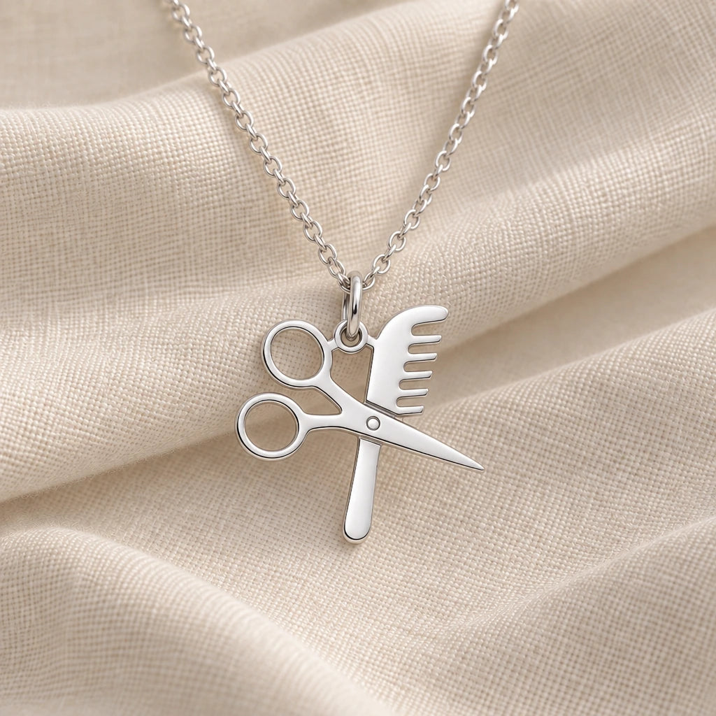 925 sterling silver hairdresser scissors and comb pendant necklace on cream fabric