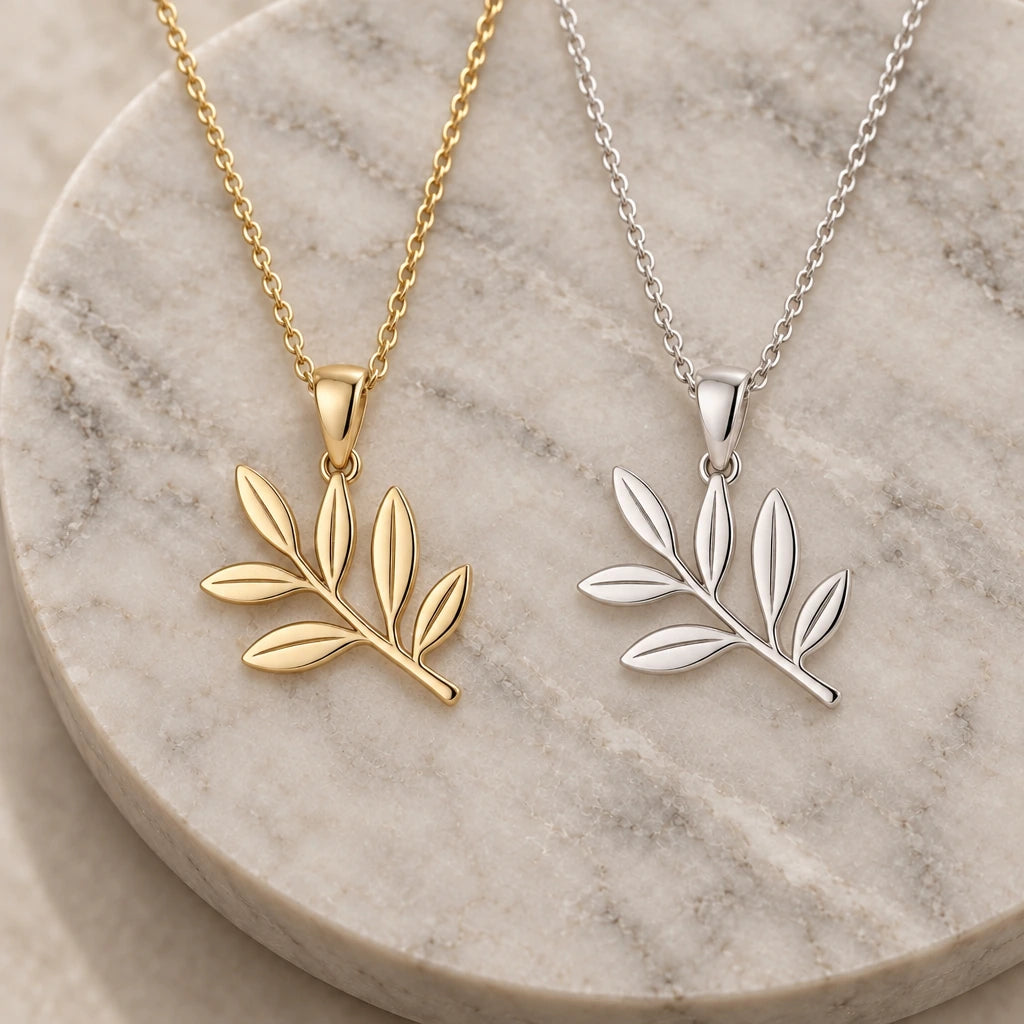 Olive Branch pendant necklace in silver and gold finishes side by side