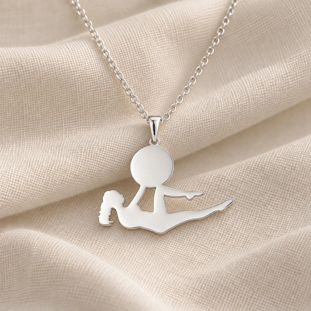 925 sterling silver yoga bow pose pendant necklace on cream fabric