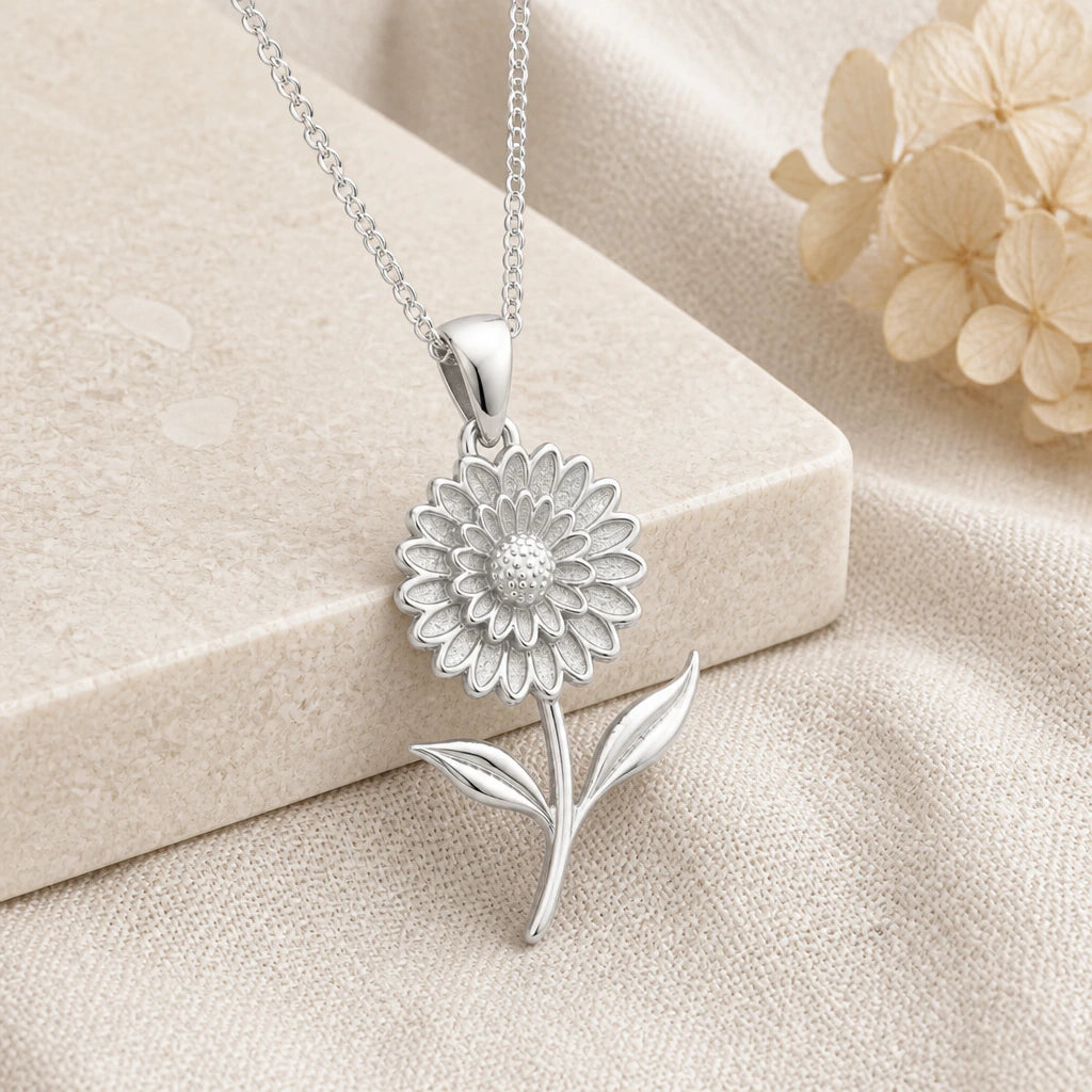 925 sterling silver marigold bloom flower pendant necklace on softly folded cream linen