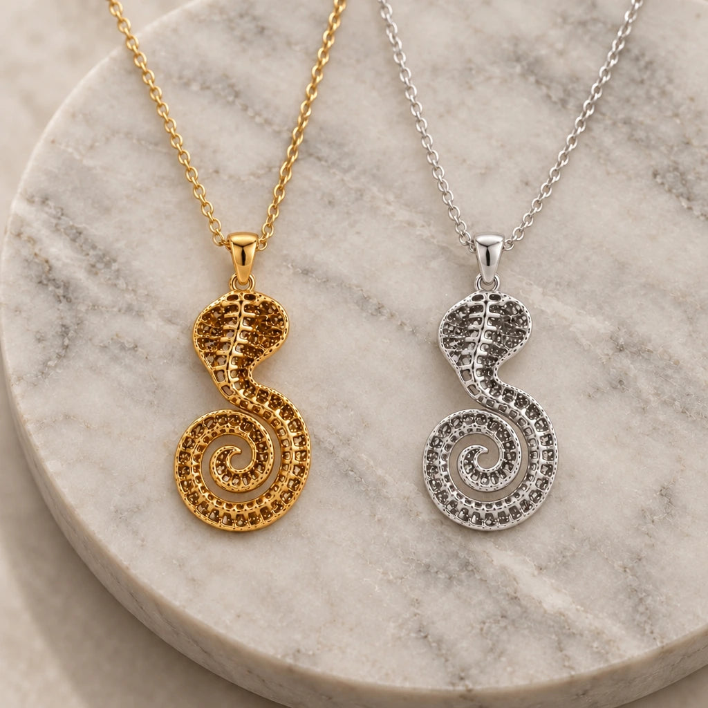 Sacred Cobra Fossil pendant necklace in silver and gold finishes side by side
