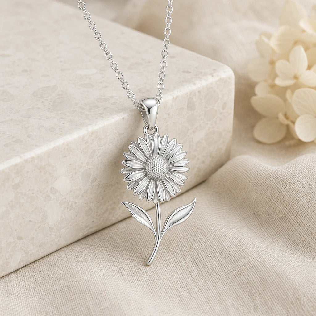 925 sterling silver gerbera daisy flower pendant necklace on softly folded cream linen