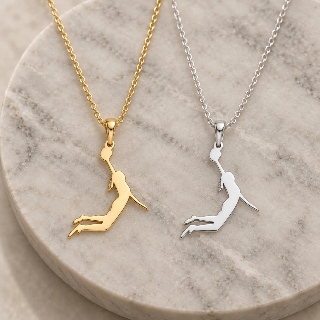 Female Basketball Player pendant necklace in silver and gold finishes side by side