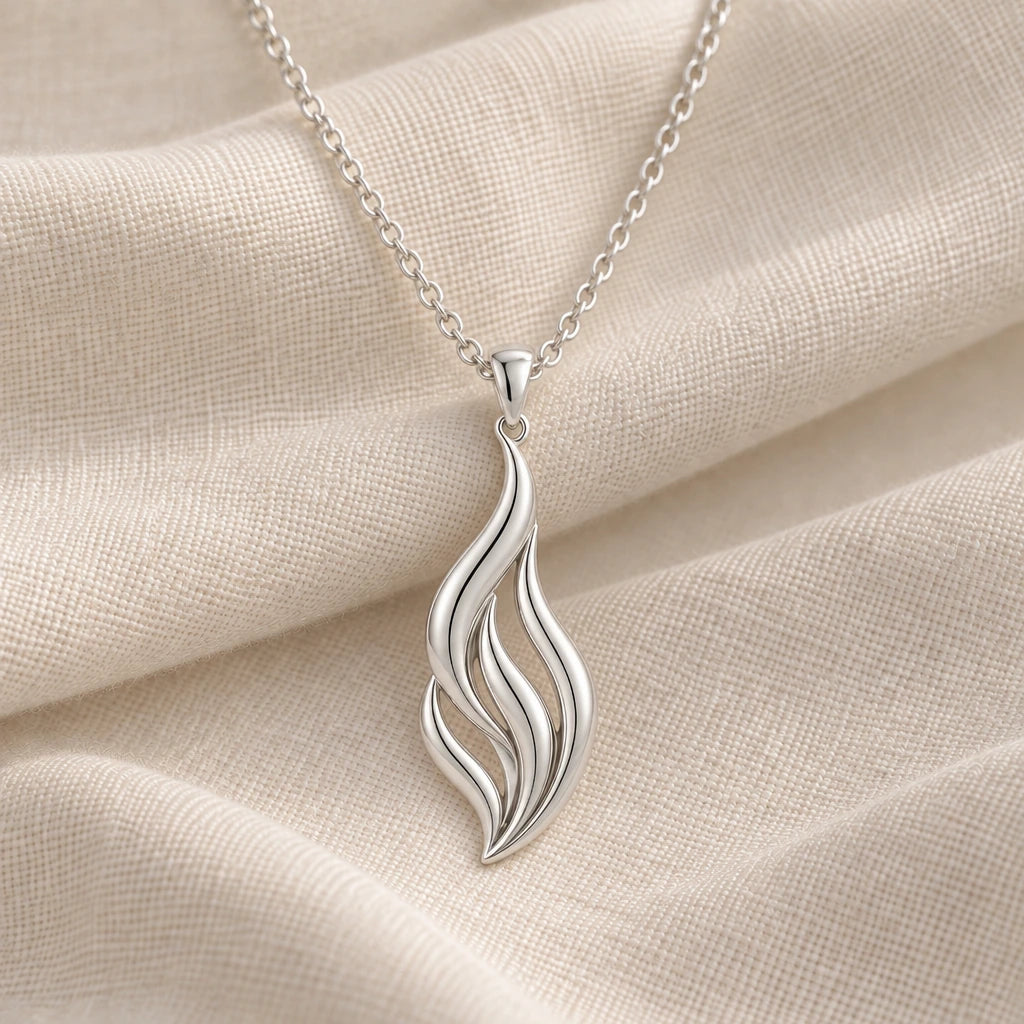 925 sterling silver aurora flame pendant necklace on cream fabric
