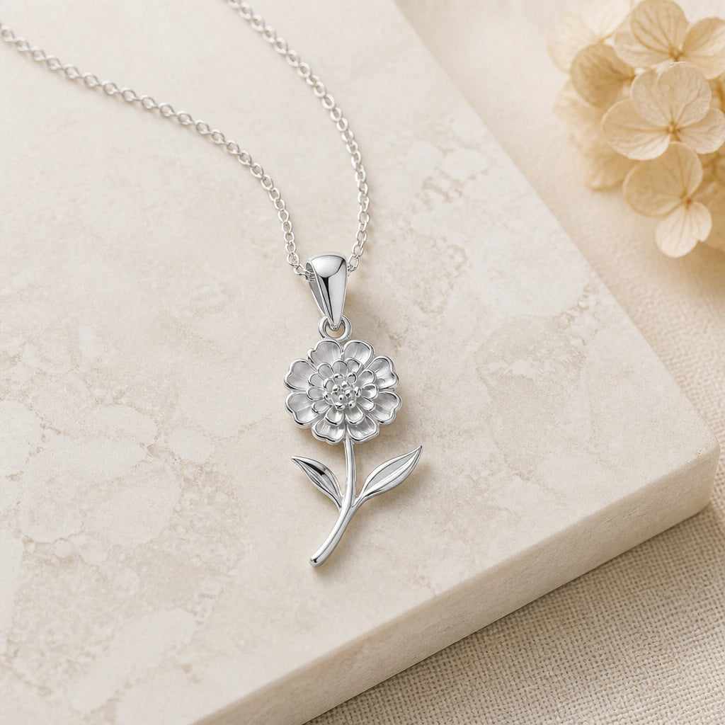 Close-up of silver lantana flower pendant showing the sculpted detail