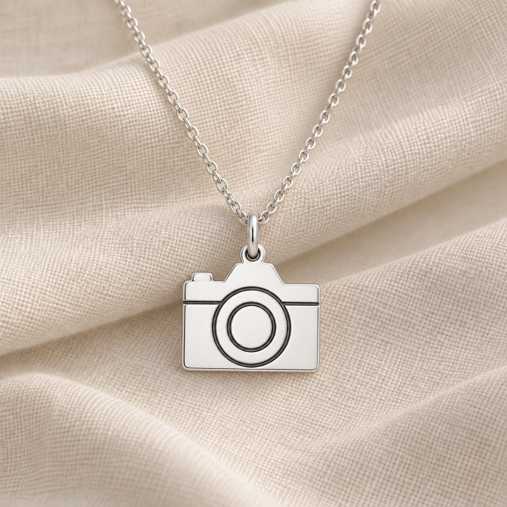 925 sterling silver camera pendant necklace on cream fabric