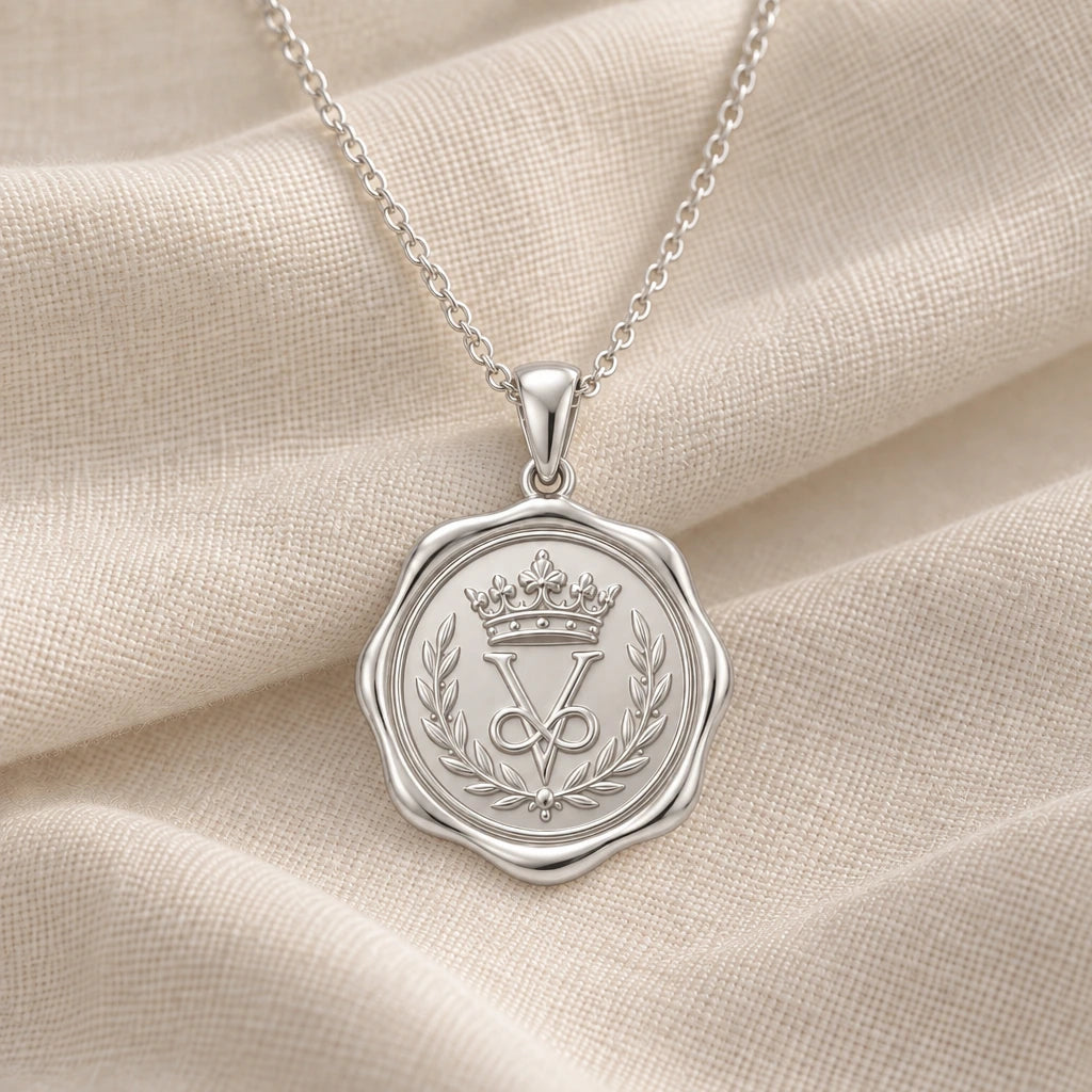 925 sterling silver crown seal medallion pendant necklace on cream fabric