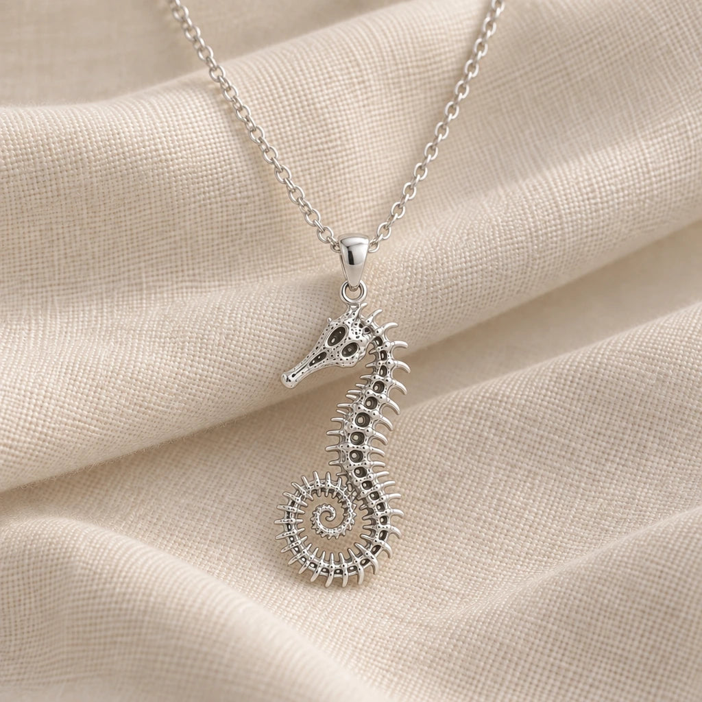 925 sterling silver fossil seahorse spine pendant necklace on cream fabric