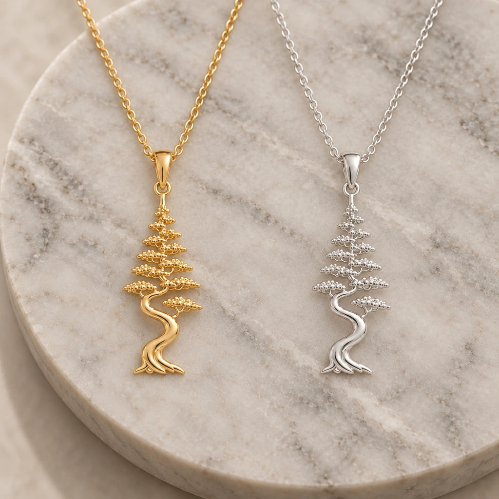 Cypress Aura Bonsai pendant necklace in silver and gold finishes side by side