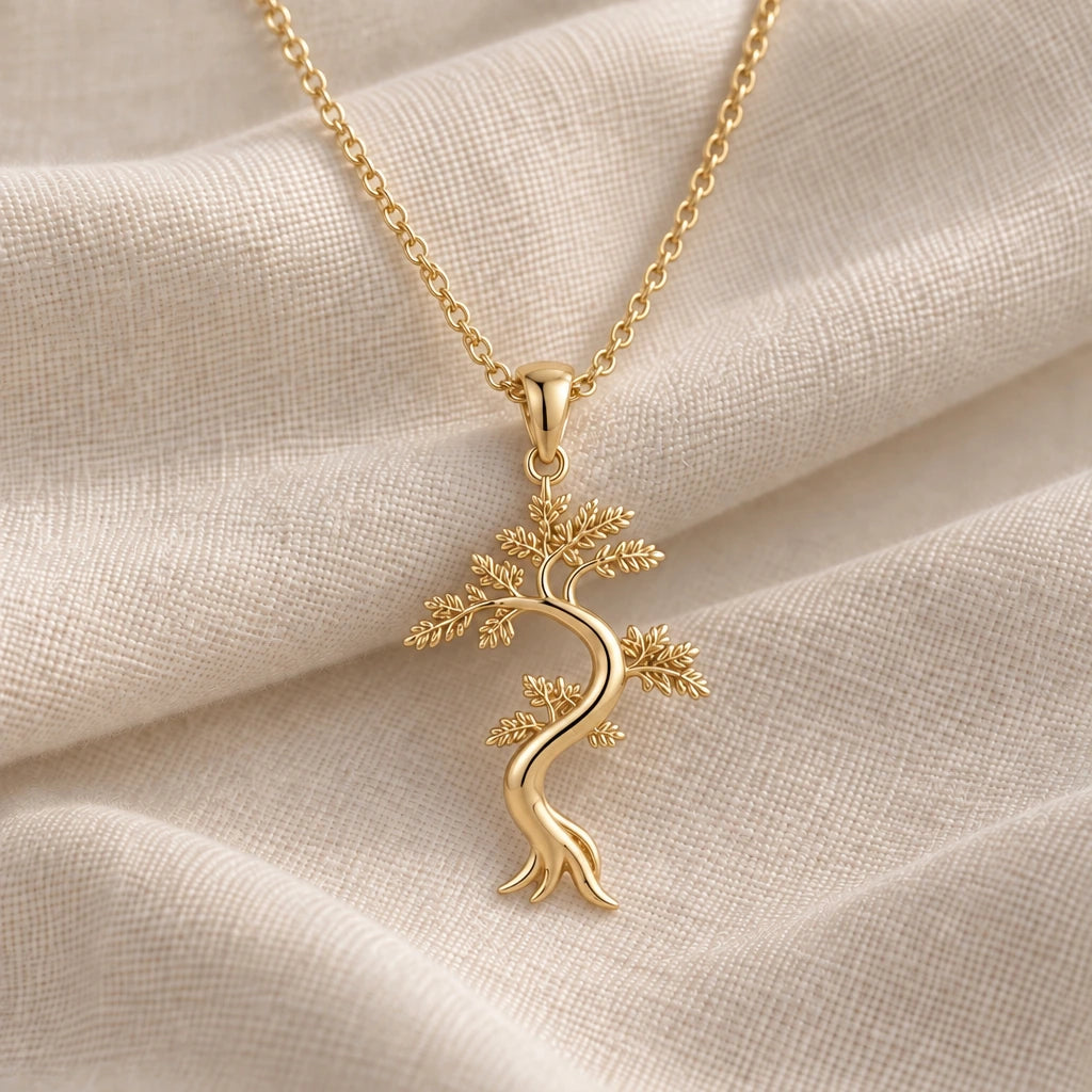 Juniper Flame Feathered Tree pendant necklace in an 18k gold plated finish